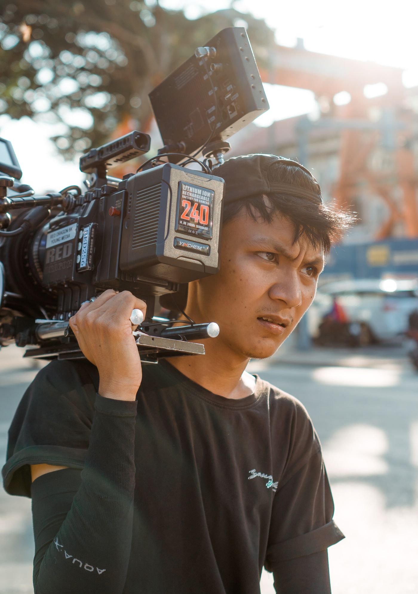 Cinematographer filming with a professional cinema camera